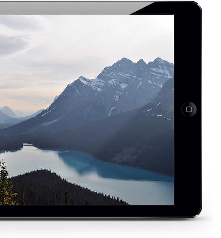 tablet with a picture of a beautiful valley on screen